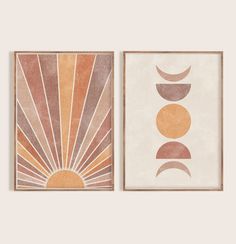 two framed art prints with sun and moon designs on the same wall, one is orange