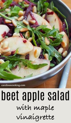 an apple salad with spinach and pine nuts