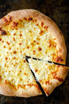 a cheese pizza with one slice missing from it and the words seriously the best pizza dough