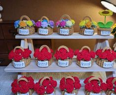 several baskets with flowers are on display in front of other baskets that have name tags attached to them