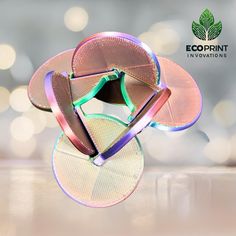 an image of a colorful object on the ground with lights in the background and text that reads, ecoprint innovations