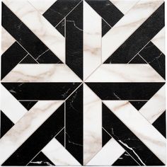 a black and white marble tile with an intricate design