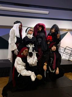 a group of people dressed up in costumes