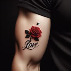 a woman with a rose tattoo on her thigh and the word love written in cursive writing