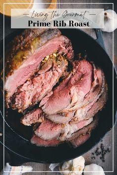 corned beef roast in a cast iron skillet with garlic on the side