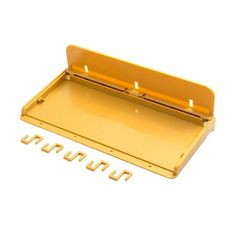 an empty yellow plastic tray with four screws