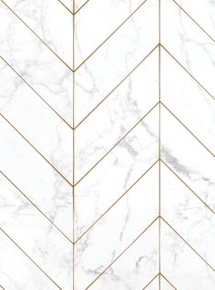 a white marble tile with gold lines on the bottom and sides, as well as a herringbone pattern