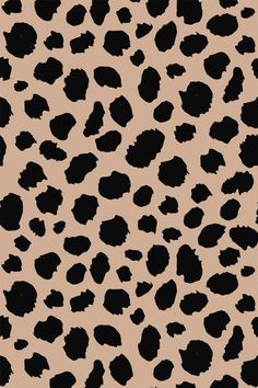 an animal print pattern with black spots