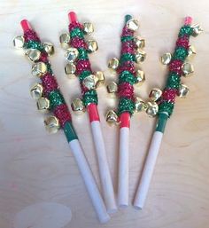 four christmas decorations on top of each other with the words jingle bell sticks, great when walking in the parade during the holidays - - - -