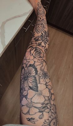 a person's arm with flowers on it