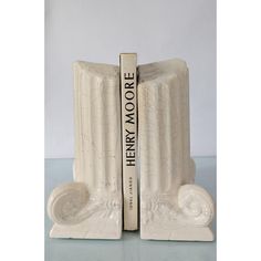 two bookends made out of white marble with the words new york written on them