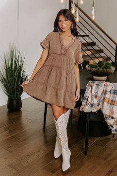 - Go with the flow in this casual dress! - Unlined mineral washed material with a subtle texture - A collared v-cut neckline with stitching for additional coverage and frayed accents - Short sleeves with rolled cuffs - A relaxed silhouette that ends in mini dress length, unfinished, frayed hemline Casual Brown V-neck Mini Dress, Brown Cotton V-neck Mini Dress, Beige Cotton V-neck Mini Dress, Beige V-neck Cotton Mini Dress, Western Boho Chic, Go With The Flow, Western Boho, Country Western, Subtle Textures