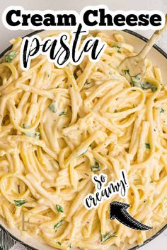 a bowl filled with cream cheese pasta on top of a table