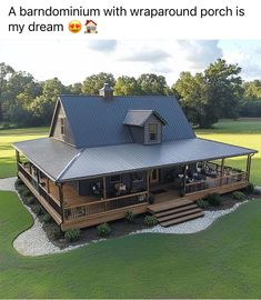 an aerial view of a large house in the middle of a field