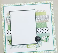 a close up of a card with flowers on it and a white paper in the middle