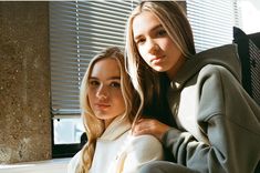 two young women sitting next to each other