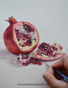 a watercolor painting of a pomegranate and its seeds