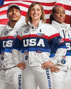 three people in white space suits standing next to an american flag with the words usa on it