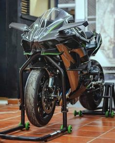 a motorcycle is parked on the ground with two wheels attached to it's frame