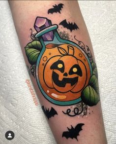 a halloween pumpkin tattoo on the leg