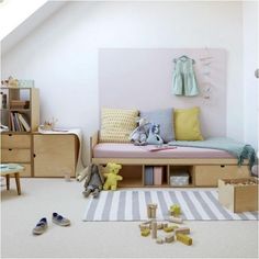 a child's bedroom with toys and furniture in it