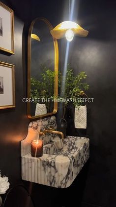 a bathroom sink sitting under a large mirror next to a wall with pictures on it