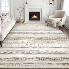 a living room with a couch, chair and fireplace