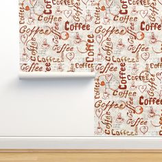 two coffee themed wallpapers in an empty room