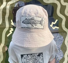 A unisex bucket hat with a handprinted lino patch sewn on. Cotton Hats With Graphic Print For Summer, Summer Cotton Hats With Graphic Print, Cotton Summer Hat With Graphic Print, Bucket Hats, Linocut, Hand Stitching, Tumble Dryer, Handmade Natural, Caps Hats