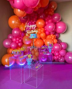 a birthday party with balloons and decorations