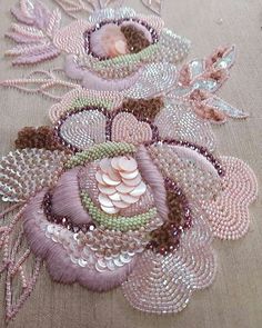 a close up of a table cloth with beads and sequins on it's surface