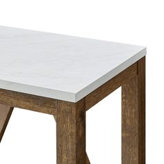 a white marble top table with wooden legs