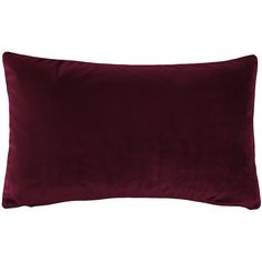 a dark red velvet pillow on a white background