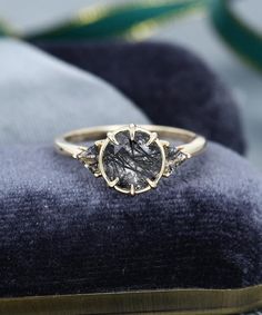 a close up of a ring on a cushion