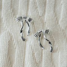 These tiny silver bow earrings are so cute and trendy.  It's the perfect dainty, minimalist jewelry! Cute Silver Earrings With Bow, Chic Silver Earrings With Decorative Bow, Dainty Silver Bow Earrings, Earrings Kawaii, Tiny Bow, Silver Bow, Bow Earrings, Earrings Minimalist, Minimalist Jewelry