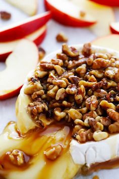 an apple dessert with nuts and caramel drizzled over it's toppings