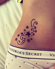 a woman with a tattoo on her stomach that says victoria's secret vix