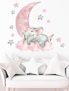 an elephant sitting on the moon with stars around it's back wall decal