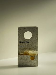 the packaging for shampoo is designed to look like it has been made from concrete