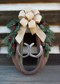 a horseshoe with a bow on top of it