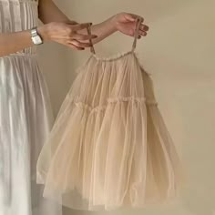 Dress your little one in elegance with our Baby Girl Cami Champagne Layered Tulle Dress. This beautiful dress features delicate cami straps and layers of soft tulle in a lovely champagne hue. Perfect for special occasions, your baby girl will look like a princess and feel comfortable all day long. Champagne Slip Dress, Champagne Party Dress, Layered Tulle Dress, Lace Mesh Dress, Baby Tutu Dresses, Tulle Party Dress