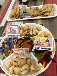 two trays filled with different types of gummy bears