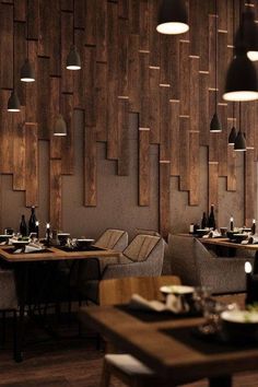 an empty restaurant with wooden walls and chairs