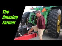 a man standing next to a tractor with the words, the amazing farmer on it