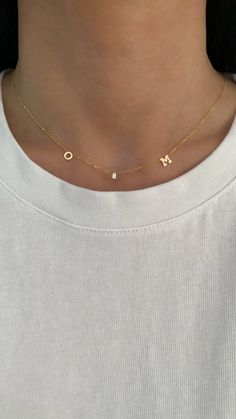 This 14K gold necklace features 2 letters + 1 dangling diamond baguette in between. Choose 2 letters to create your custom necklace! EXAMPLE: Left Letter: O Right Letter: M Available in 14K Yellow Gold or 14K White Gold Letter Measurement: Approx. 0.20" (varies slightly per letter) Uppercase letters only Letters and diamond spaced approx. 1" apart Diamond baguette: 3mm x 1.5mm - 0.05ct. FINAL SALE O Necklace Letter, Pretty Jewelry Necklaces, Diamond Baguette, Gold Letter, Letter M, Letter O, Pretty Jewelry, 14k Gold Necklace, Squad Goals