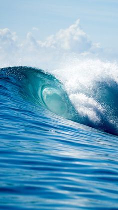 a large wave is breaking in the ocean