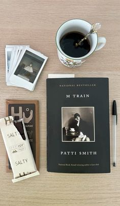 a table topped with books and a cup of coffee