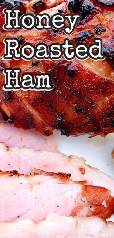 sliced ham sitting on top of a white plate with the words honey roasted ham over it