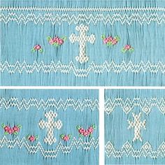 four different pictures of blue fabric with white cross stitching and pink flowers on it