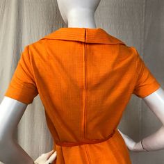 "This is a lovely short sleeve dress in a bright cheery tangerine. There's a zipper (19\") down the back with hooks at the top for the collar. The sleeves are short. There are two pockets at the waist. The belt is included. Details Size: unmarked, fits a modern 4 - 6 Bust: 36\" Sleeve length: 7\" Shoulder: 14.5\" Waist: 32\" Hips: 36\" Length: 41\" Belt: 26\" - 31\" Label: unmarked Colors: Tangerine Condition: Excellent, no issues." Mod Style, Mod Fashion, Dress Short Sleeve, Mod Dress, Orange Dress, Short Sleeve Dress, Dress Short, Sleeve Dress, High Neck Dress